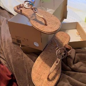 Brand new. Never worn rose gold sandals